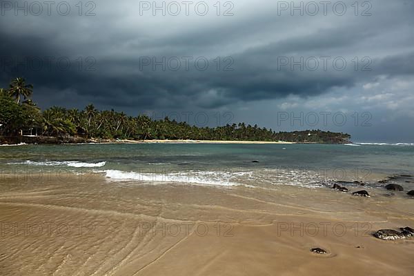 Beach and gathering storm. Mirirssa