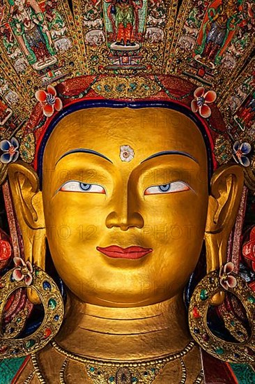 Maitreya Buddha statue face close up in Thiksey Gompa. Ladakh
