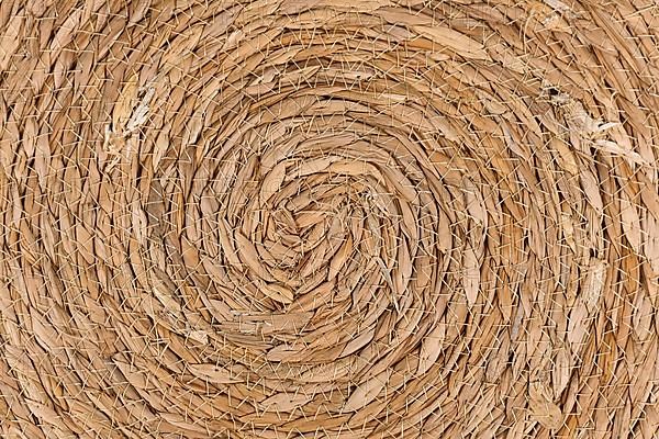Close up of round weave wicker basket pattern background