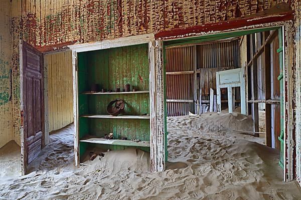 Residential buildings taken over by desert sand