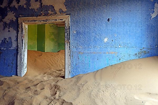 Residential buildings taken over by desert sand