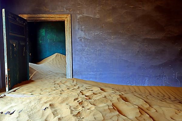 Residential buildings taken over by desert sand