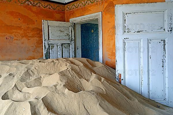 Residential buildings taken over by desert sand