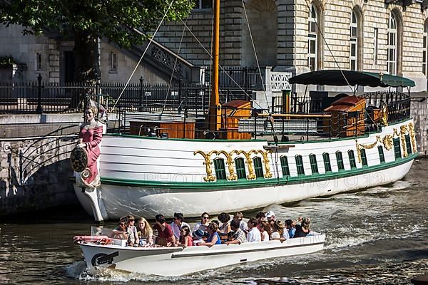 Tourists in a boat on the river Leie