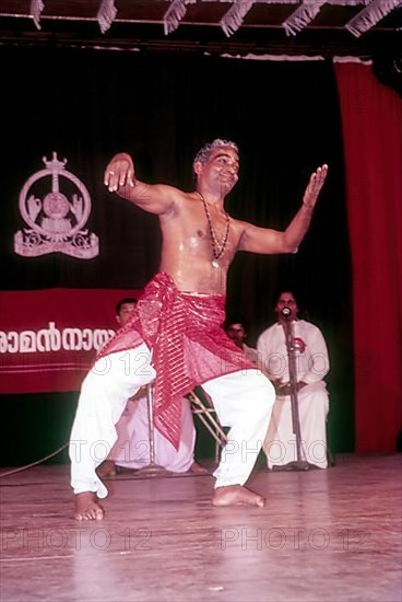 Kalamandalam Gopi demonstrating kathakali exercise in Kerala Kalamandalam