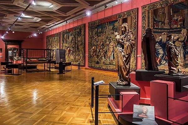 Wooden sculptures and tapestries from the 16th century in the Cinquantenaire Museum in Brussels