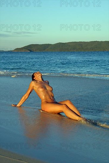 Woman at nudist at the sea