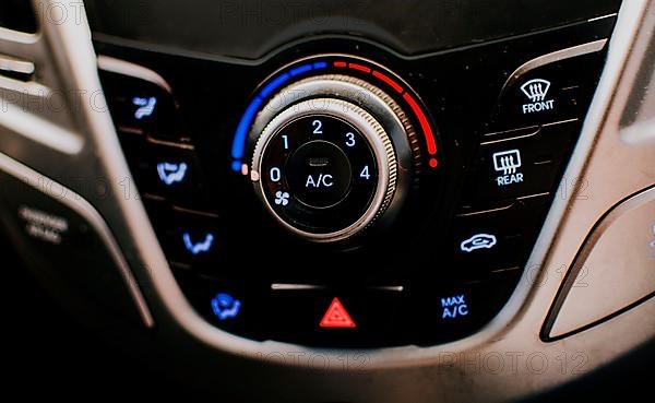 Front view of a car air conditioning control panel. Air conditioning knob of a car. Close up of automotive air conditioning switch panel