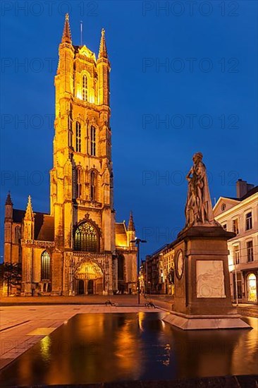 Monument to Jan Frans Willems and Saint Bavo Cathedral in the evening. Sint-Baafsplein