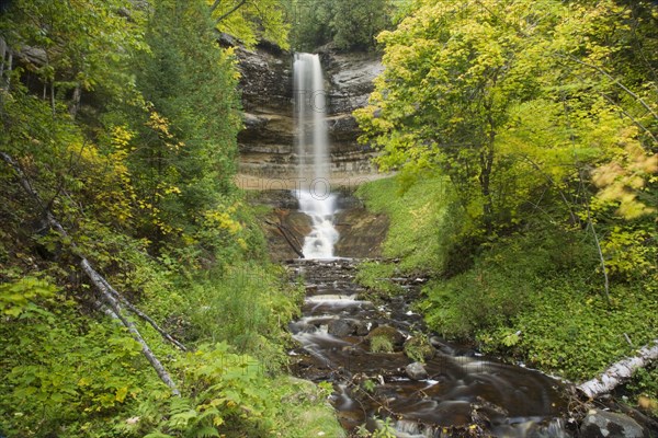 Waterfall flowing over a sandstone cliff