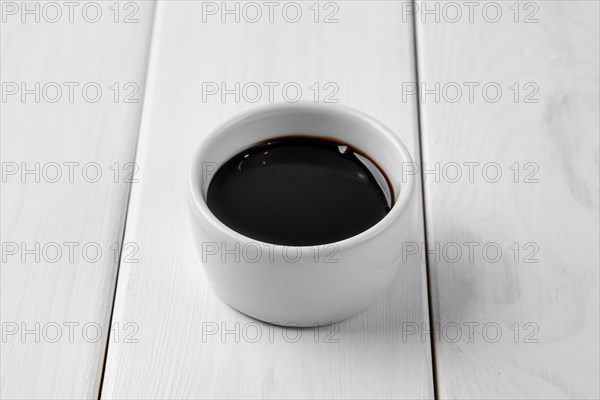 Soy sauce in ceramic gravy boat