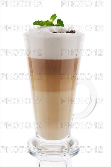 Cappuccino in tall glass isolated on white background