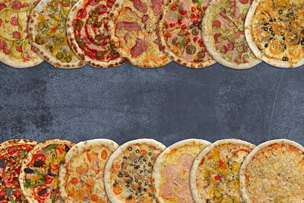 Horizontal collage of different baked pizzas on metal plate. Top view