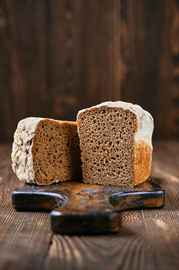 Loaf of artisan rye bread cut on half