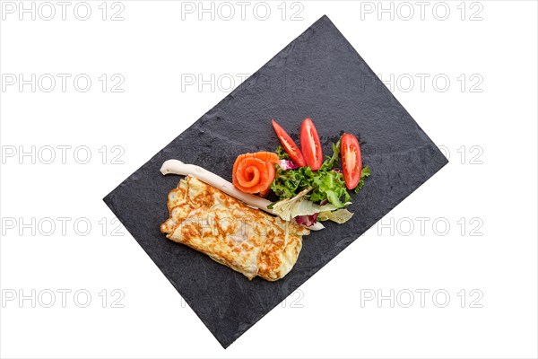 Omelette with salmon isolated on white
