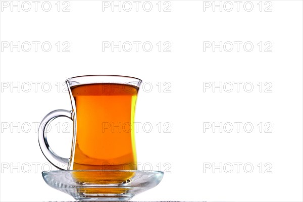 Low angle photo of cup with hot tea with copy space on white background