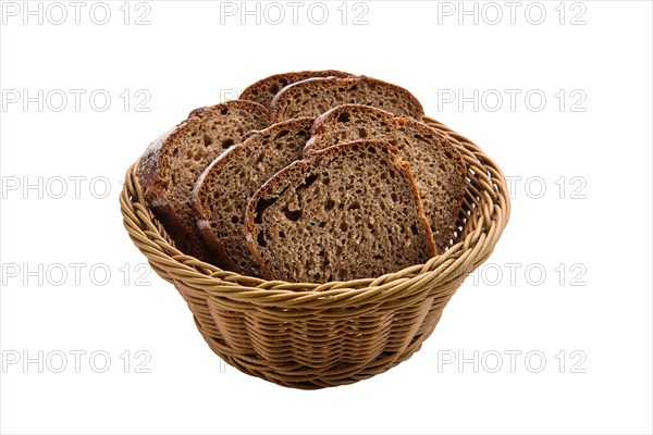 Basket with brown bread isolated on white