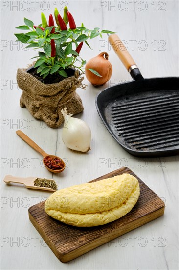 Homemade cheese for frying on cast iron grill pan