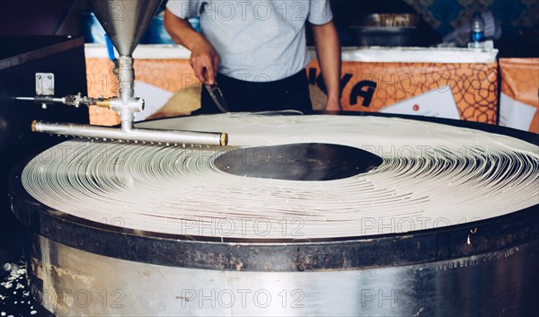 The making of Turkish desert Kadayif pastry in display
