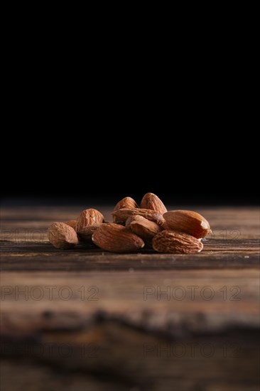 Almonds on the wooden background