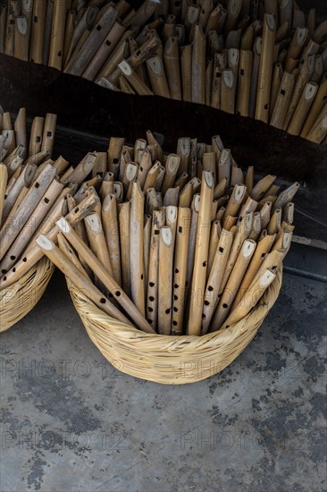 Dozens of handmade wooden flutes in the view