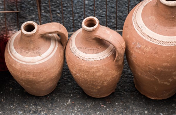 Ancient metal jug in oriental style in antique market