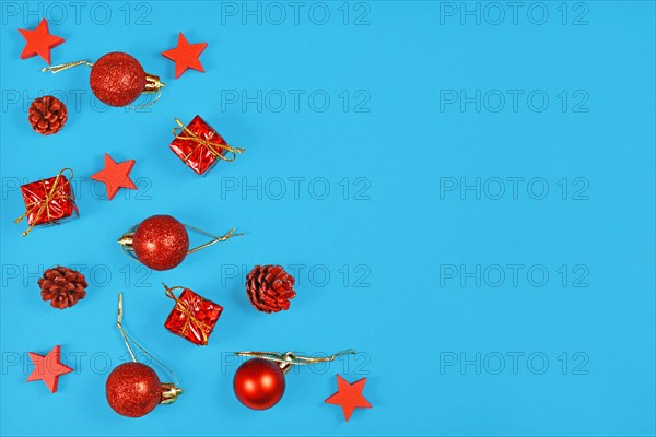 Christmas flat lay with red ornaments in shape of tree baubles