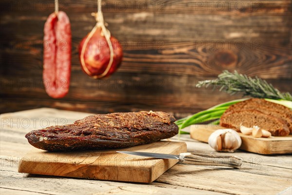 Air dried beef meat on wooden cutting board
