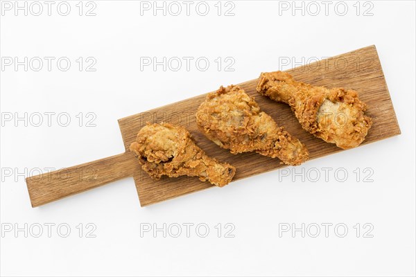 Top view fried chicken drumsticks cutting board. Resolution and high quality beautiful photo