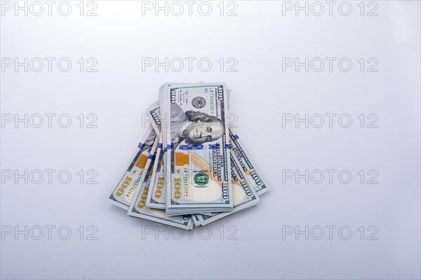 American 100 dollar banknote bundles placed on white background