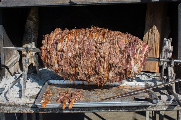 Turkish cag Kebab on pole in horizontal position