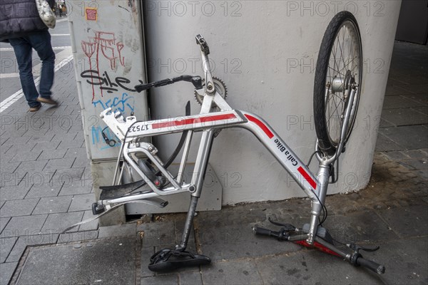 Bicycle standing on handlebars and saddle with dismounted rear wheel from Call a Bike of Deutsche Bahn