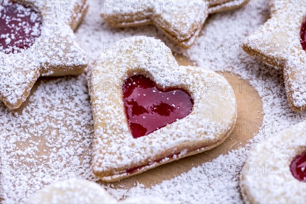 Freshly baked Spitzbuben in the shape of a heart