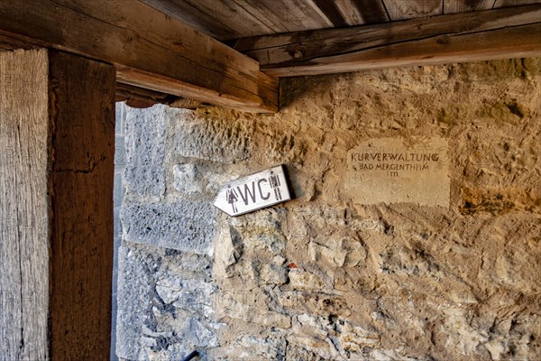Sign WC at the historic town wall with covered battlements