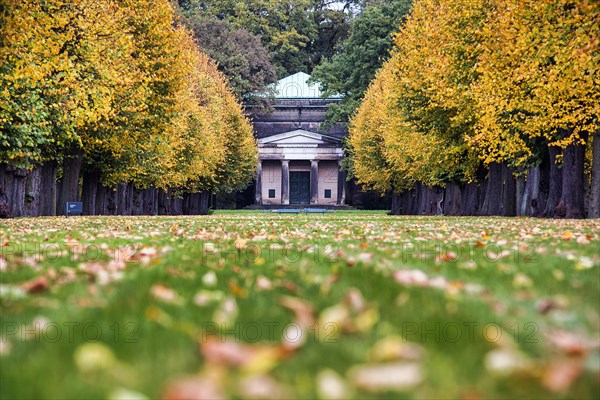 Autumn leaves in a meadow in front of the Guelph Mausoleum