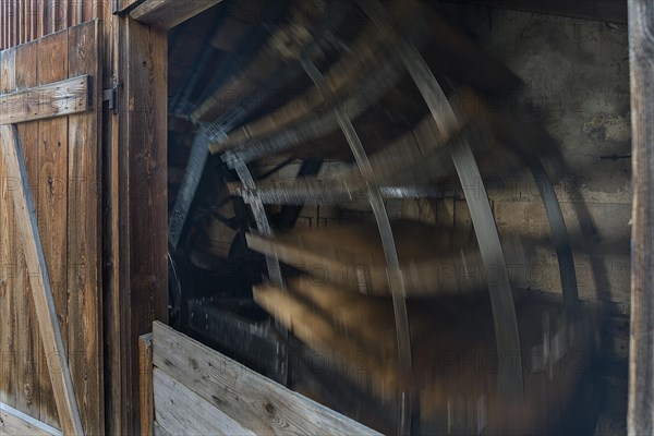 Water wheel in motion at a historic mill