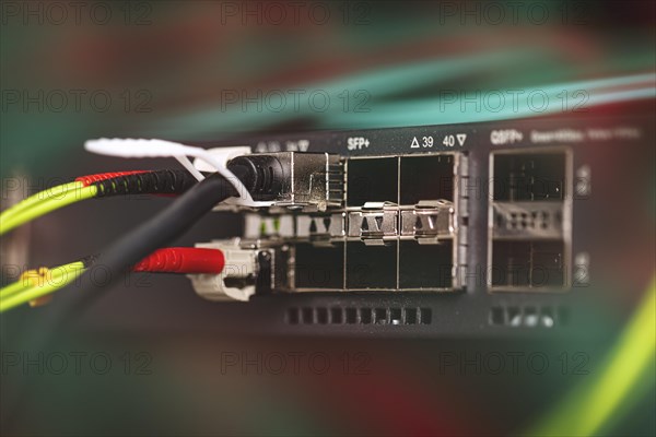 Fibre optic cables plug into a Fibre Channel Switch