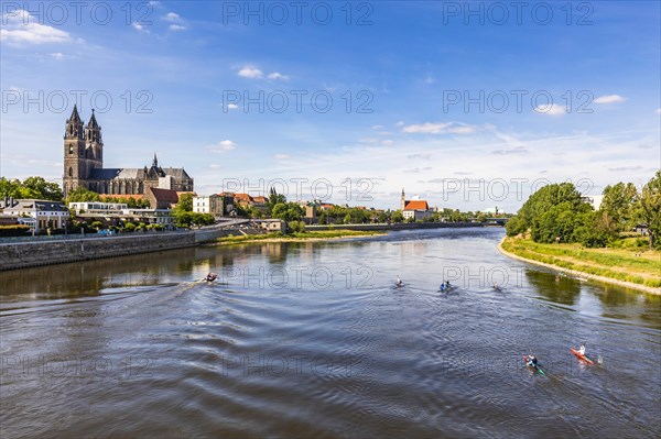 Magdeburg Cathedral and canoeists on the Elbe