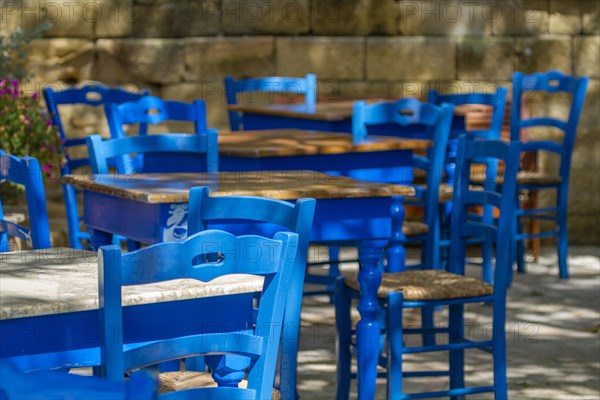 Blue tables and chairs in a cafe
