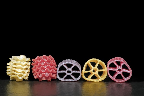 Colourful pasta in different shapes