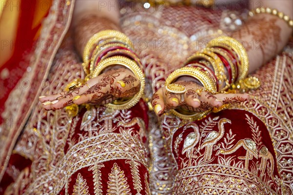 Traditional bridal jewelry and henna decoration on the hands of Hindu bride on her wedding day