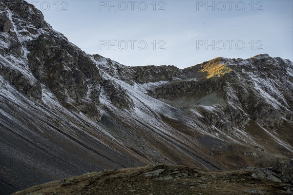 Lightly snow-covered mountains in autumn on the Flueela Pass