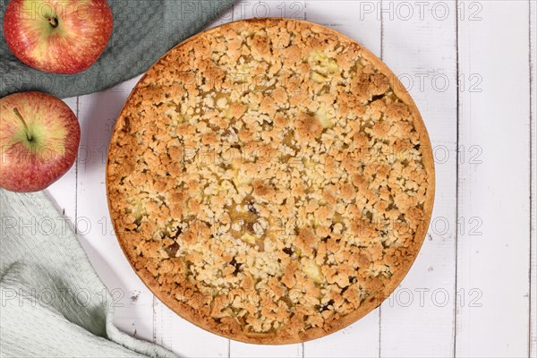 Top view of traditional European apple pie with topping crumbles called 'Streusel'