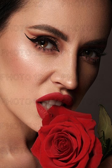 Beautiful brunette woman iwith a classic make-up