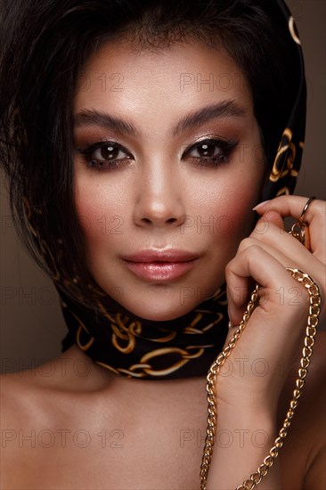 Beautiful Asian brunette model with volume curls