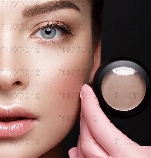 Close-up of female eyes with eyebrow shadows. Eye makeup cosmetics