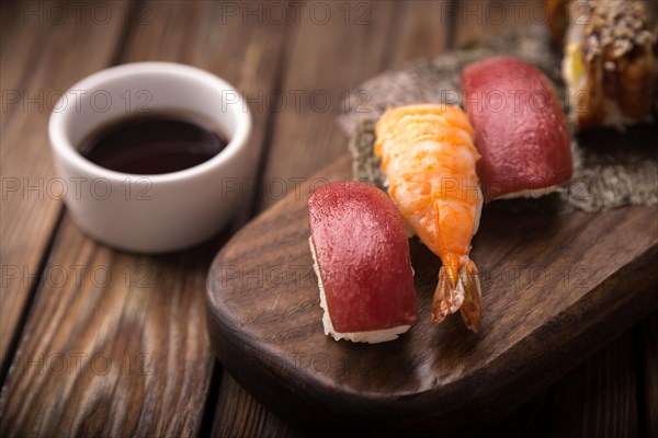 Sushi set on a wooden tray. Photo shot in studio