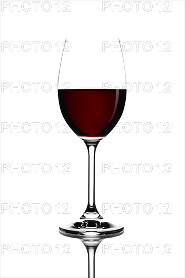 Red wine in a glass isolated on white background
