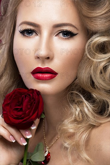 Beautiful blonde in a Hollywood manner with curls