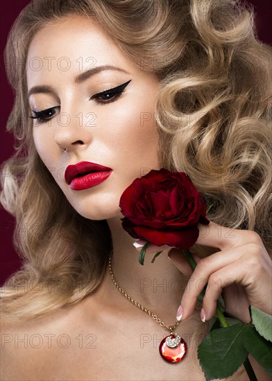 Beautiful blonde in a Hollywood manner with curls